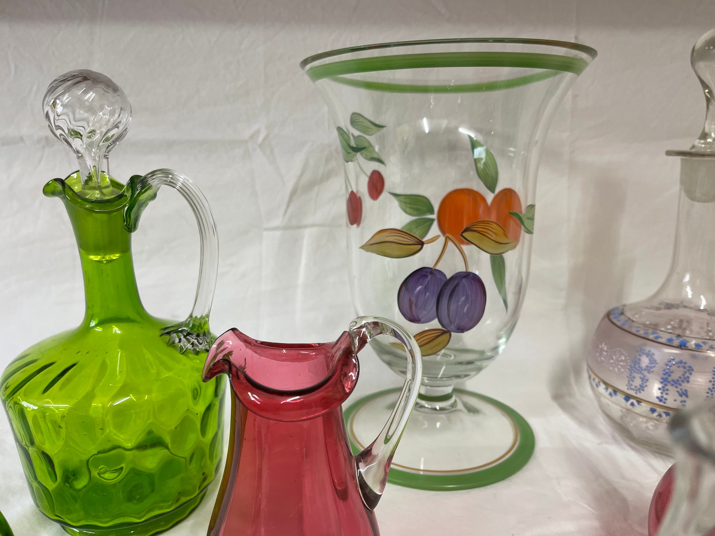 A selection of coloured and hand painted glass ware to include: 3 x cranberry jugs, 3 x green jugs - Image 5 of 6
