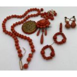 A quantity of 19thC coral jewellery to include brooch, earrings, beads etc. 71.7gm, approx 8mm diame