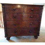 A 19thC mahogany chest of 2 short over 3 long drawers. Columns to sides on bun feet. 108cm w x 49.