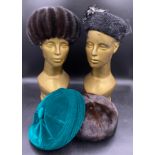 Four hats to include two mink, one black Persian lamb and one green velvet with button decoration.