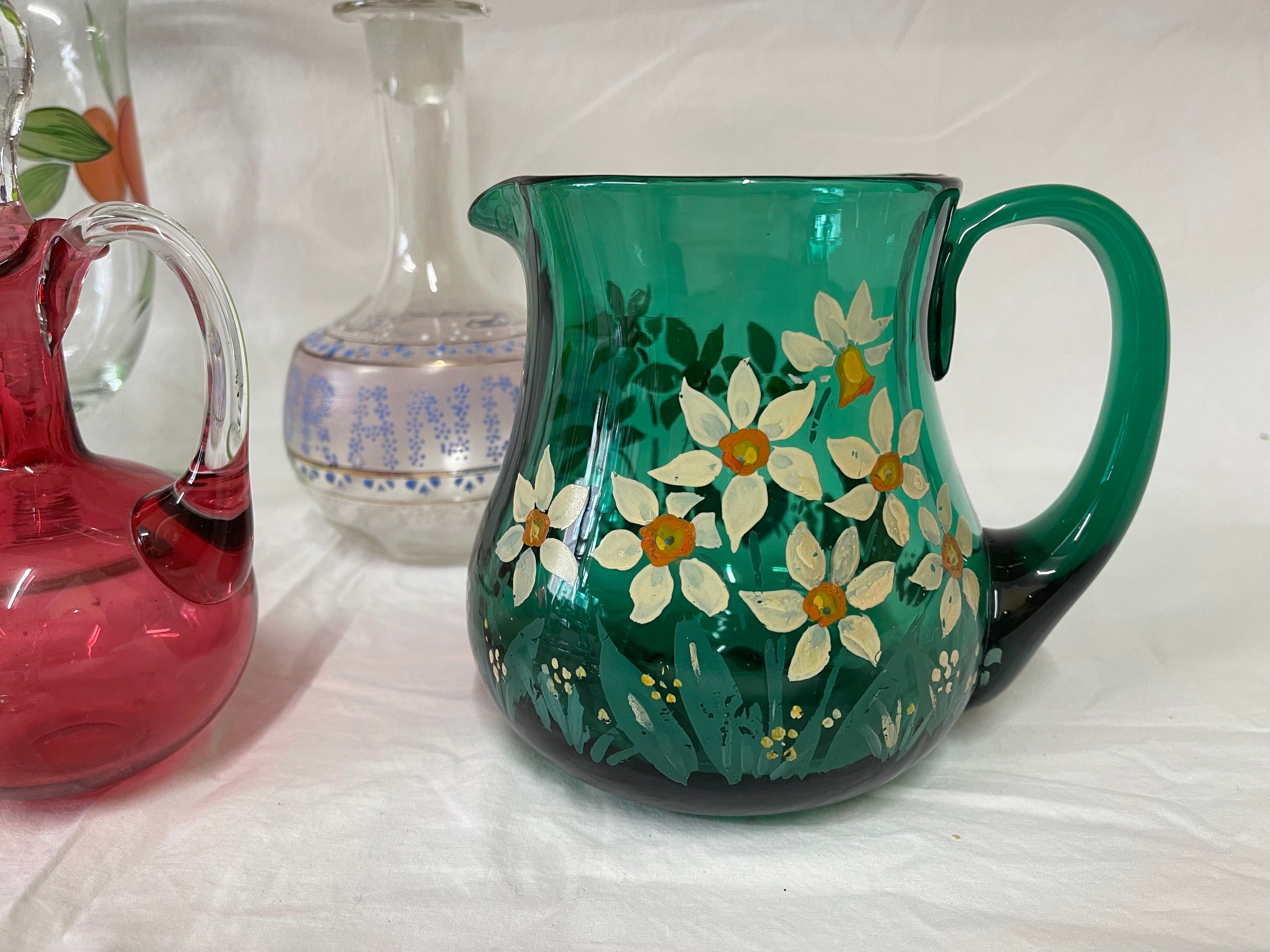 A selection of coloured and hand painted glass ware to include: 3 x cranberry jugs, 3 x green jugs - Image 2 of 6