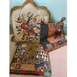 Three embroidered cushions to include wool work and beadwork.Condition ReportGood condition.