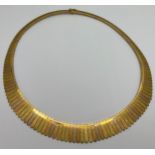 An 18ct gold collar style necklace in tri colour gold. Weight 47gm.Condition ReportGood condition.