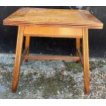 An early 20thC Arts & Crafts oak folding card table with green baize lining. 45 d x 64 w x 59cm h