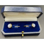 A pair of 14ct gold cufflinks set with moonstone.