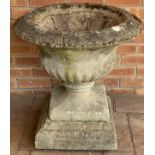 A reconstituted stone urn. 60cm d x 64cm h.Condition ReportSome cracks to top.