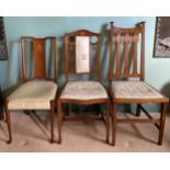 Three Arts and Crafts inlaid single chairs, two mahogany, the other oak.Condition ReportGood