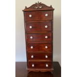 A mahogany miniature set of 6 drawers with porcelain handles. 74.5 h x 30 w x 17cm d.Condition