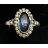 A blue & clear stone ring marked 9ct to shank, size O, weight 3gm.Condition ReportGood condition.