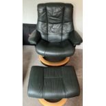 Two dark green leather Stressless reclining armchairs plus footstools, one Grandfather and one