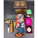 A miscellany to include vintage tins, Columbus Watch Co pocket watch and box, snuff box, glass scent