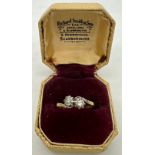 A 9ct gold and platinum ring set with 2 diamonds. Weight 2gm. Size M.