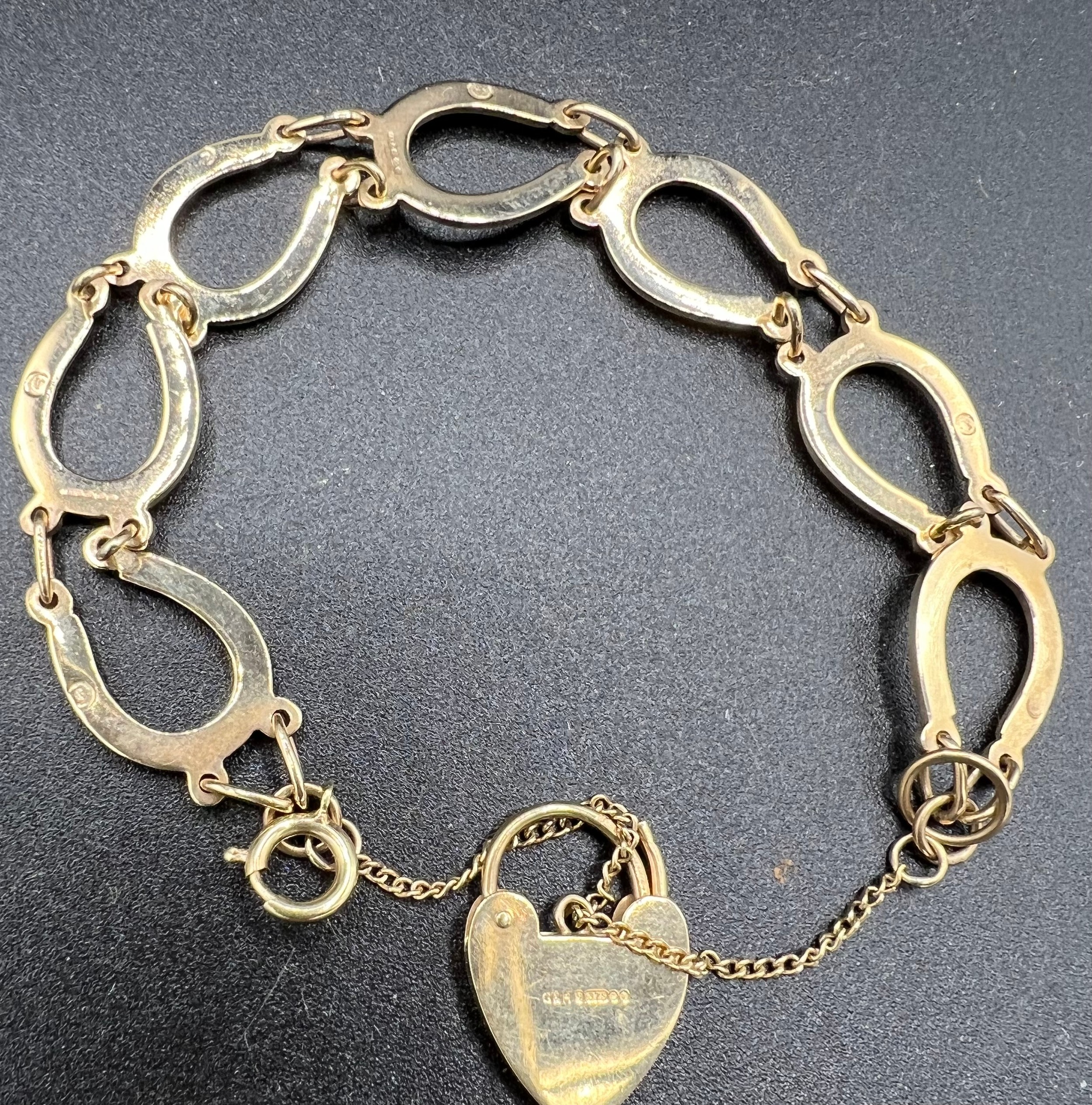 A 9ct gold horseshoe bracelet. Weight 11.9gm.Condition ReportGood condition. - Image 3 of 3