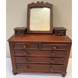 A 19thC miniature mirror backed chest of drawers. 34 w x 14 d x 29cm h without mirror.Condition