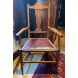 Oak armchair with inlaid panel. Arm to arm 55cm, to back 105cm.