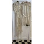 Two silk and lace vintage wedding dresses with six floral silk headbands, some with beads.