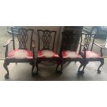 Four early 20thC mahogany dining chairs, 2 carvers and 2 side chairs with ball and claw feet.