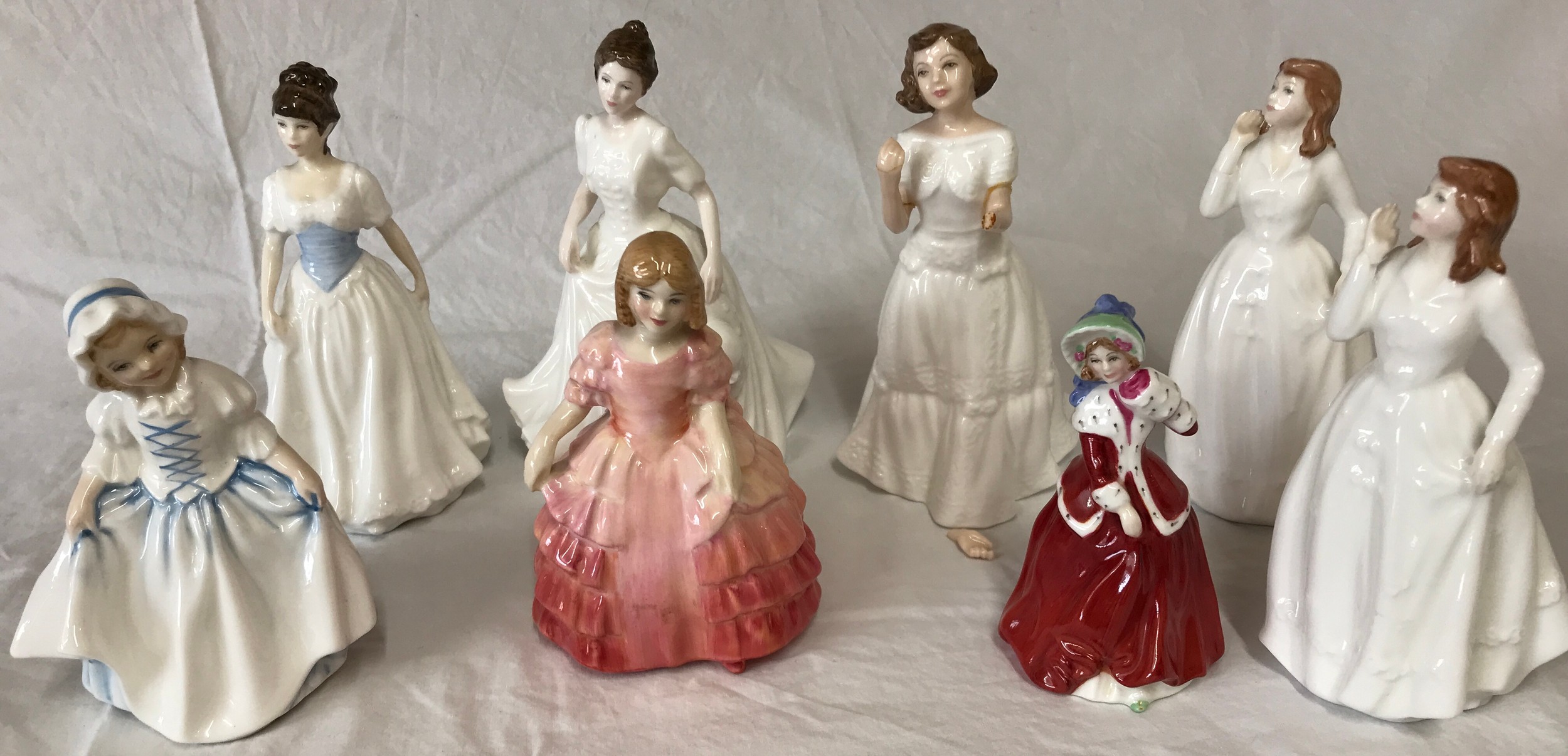 Eight Royal Doulton figurines: Melody, Harmony, Dinky Do, Rose, Christmas Morn, Joy x 2 and Welcome.
