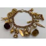 A 9ct gold bracelet with various charms of various carat gold. 79.4gm.