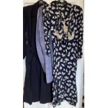 Three vintage clothing items to include a navy long belted coat by Marlbeck Model, blue cotton smock