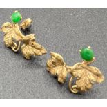 Yellow metal leaf earrings set with jade. Test as 18ct gold. 3.5gm. 25mm l.