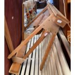 A pair of unused wooden upholstery stands.