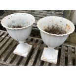 A pair of cast iron urns measuring 51.5 h x 38cm d.Condition ReportOne with crack, both have rust