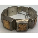 A Peruvian white and yellow metal bracelet marked .925 and 18k to clasp. 86gm weight.Condition