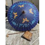 A Japanese blue painted parasol, early 20thC, with a bamboo shaft, painted with 4 butterflies with a