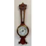 An Art Nouveau oak aneroid barometer, Robert Curtis & Son, Hull. 91cm h.