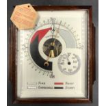 An early 20thC oak cased barometer, 28 x 23cm.
