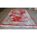 A large red ground Chinese carpet. 370cm x270cm.