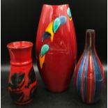 Poole pottery to include three vases of variant heights and patterns tallest 38cm h. Stripy vase