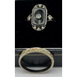 Two vintage 9 carat gold rings, one with silver and black stone.