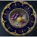 A Coalport scalloped cabinet plate by Frederick H. Chivers. Having cobalt blue and raised gilt