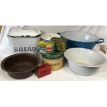 A collection of enamel ware to include 2 Bread bins, 3 bowls and 4 tins. Blue bowl 55cm w, Bread bin