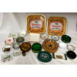 Brewery memorabilia to include ceramic and glass ashtrays and two metal trays together with