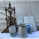 Cast iron umbrella stand together with various enamelled items.