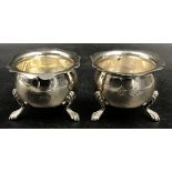 A pair of silver salts on three pad feet, hallmarked Chester 1918 makers mark Barker Brothers (