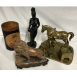 A miscellany to include carved onyx lion on carved wooden base, a heavy brass ornamental group