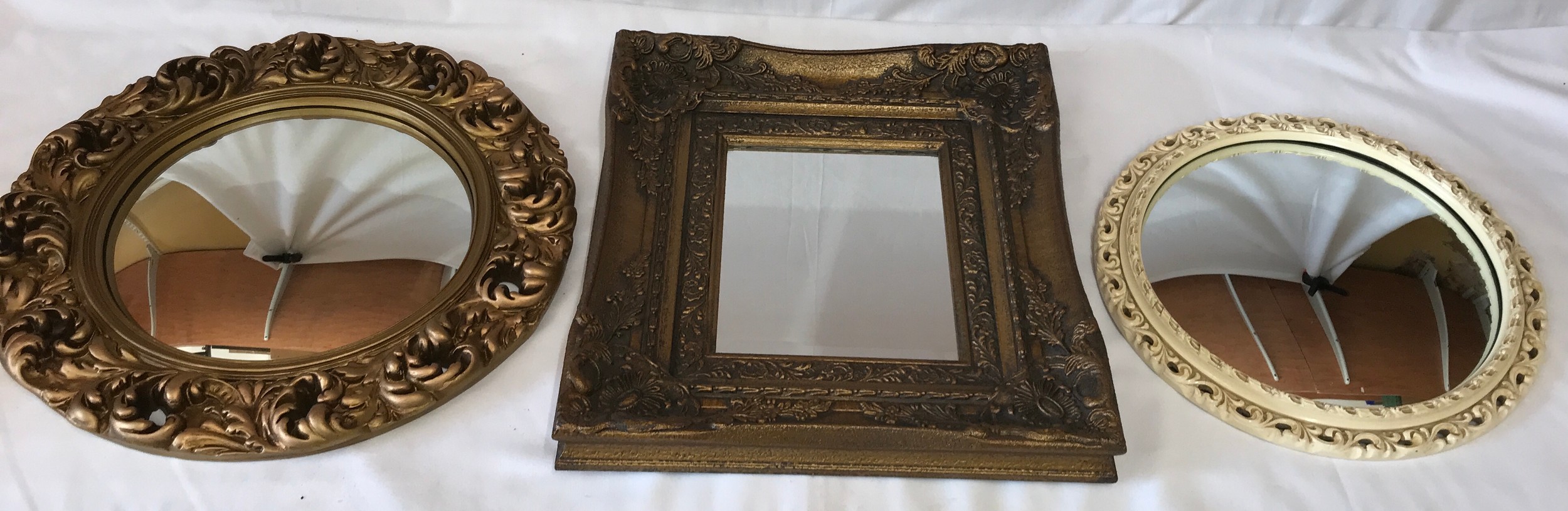 Three contemporary mirrors two gilt framed largest round one 46cm diameter, oblong gilt 45 x 39cm