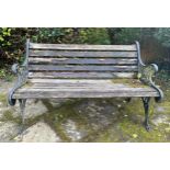 A wooden and cast iron bench. 126 w x 78cm h.
