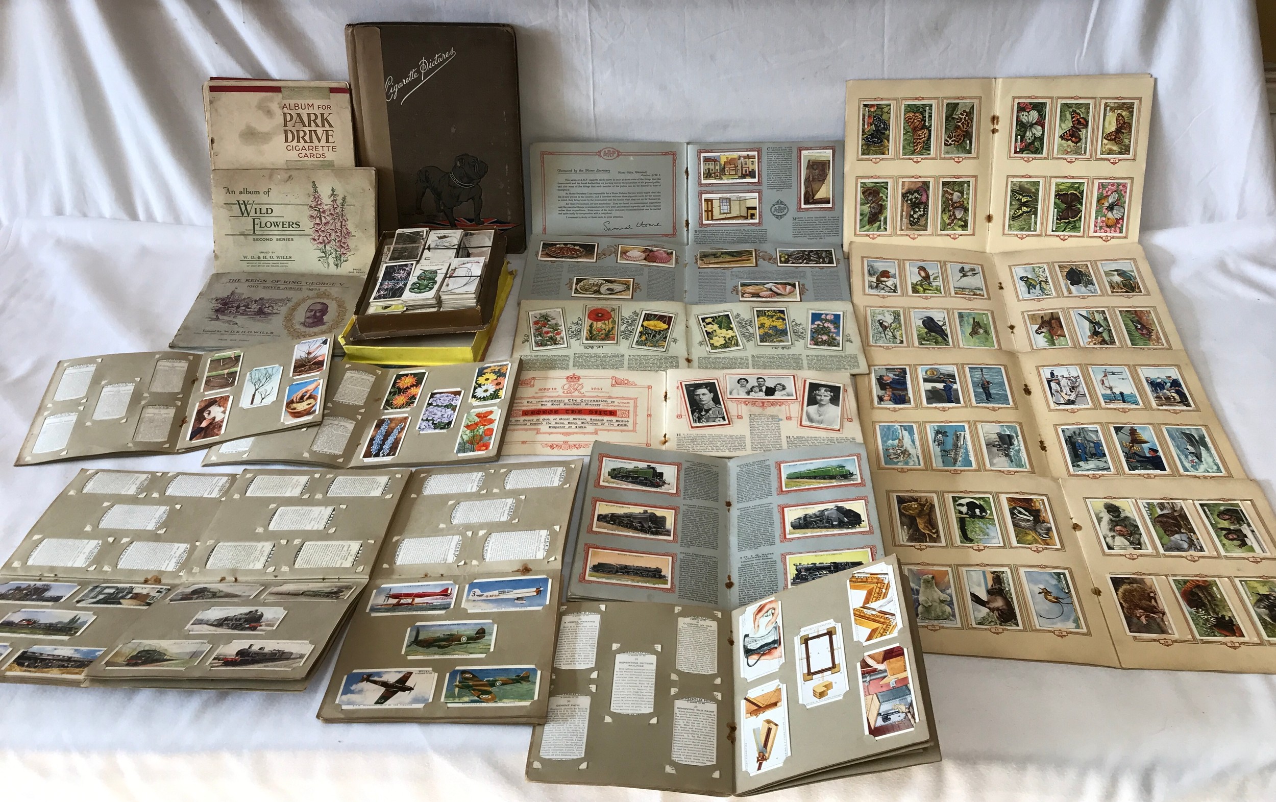 A large collection of cigarette cards, full sets in 11 Wills and 4 Park Drive card albums to include