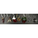 Seven Swarovski glass Christmas tree ornaments to include: candy cane, Christmas tree, stocking,