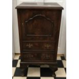 A small mahogany chest with door over two drawers. 76 x 32 d x 39cm w.
