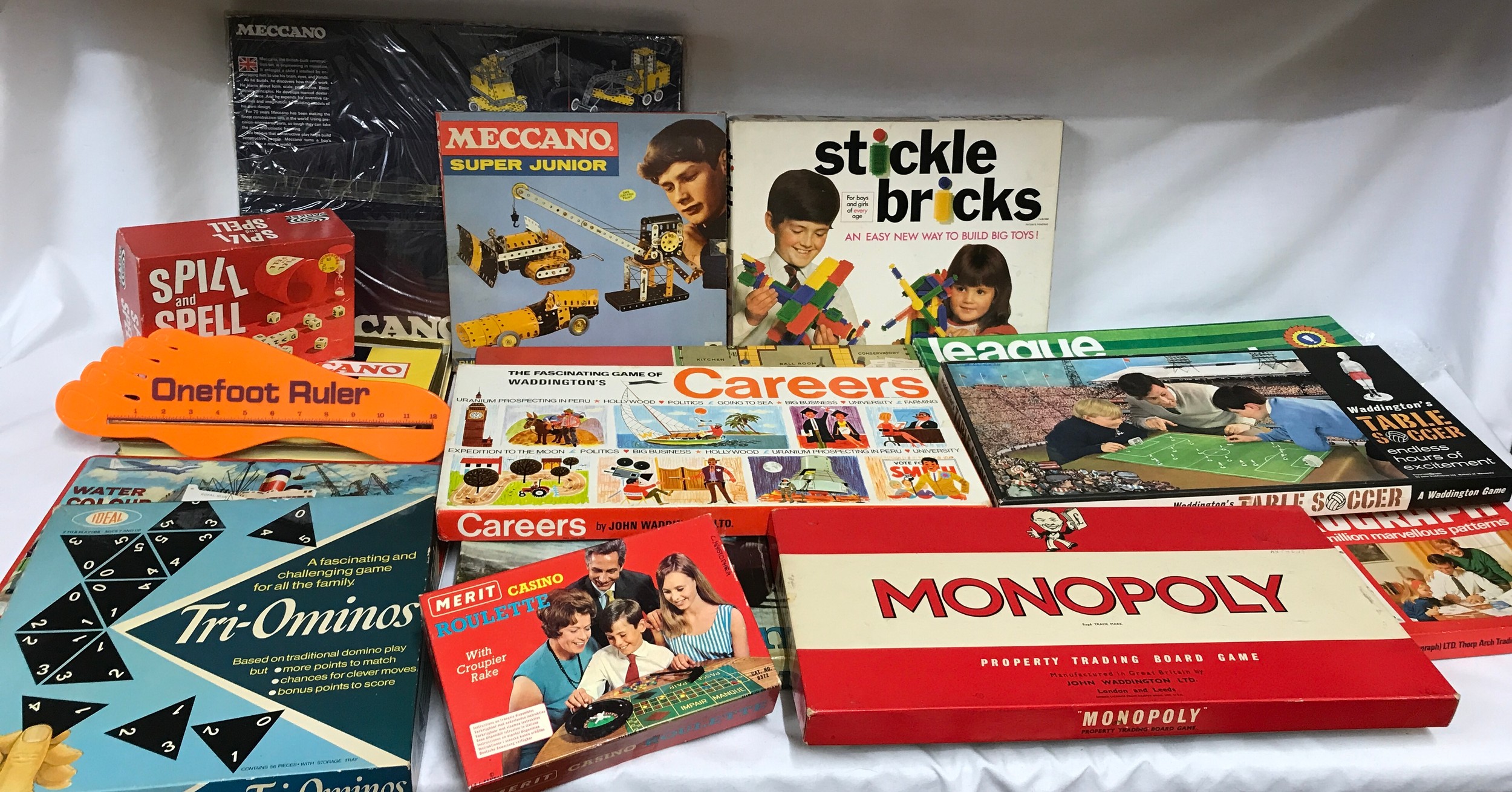 A collection of toys and games mainly board games to include Waddington's table soccer, Monopoly,