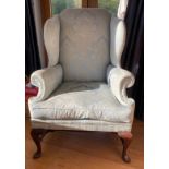 A 20thC wing back armchair 117 h x 82cm w.