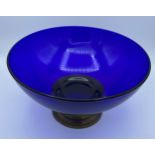 A 20thC blue glass bowl on brass pedestal. 26cm d.