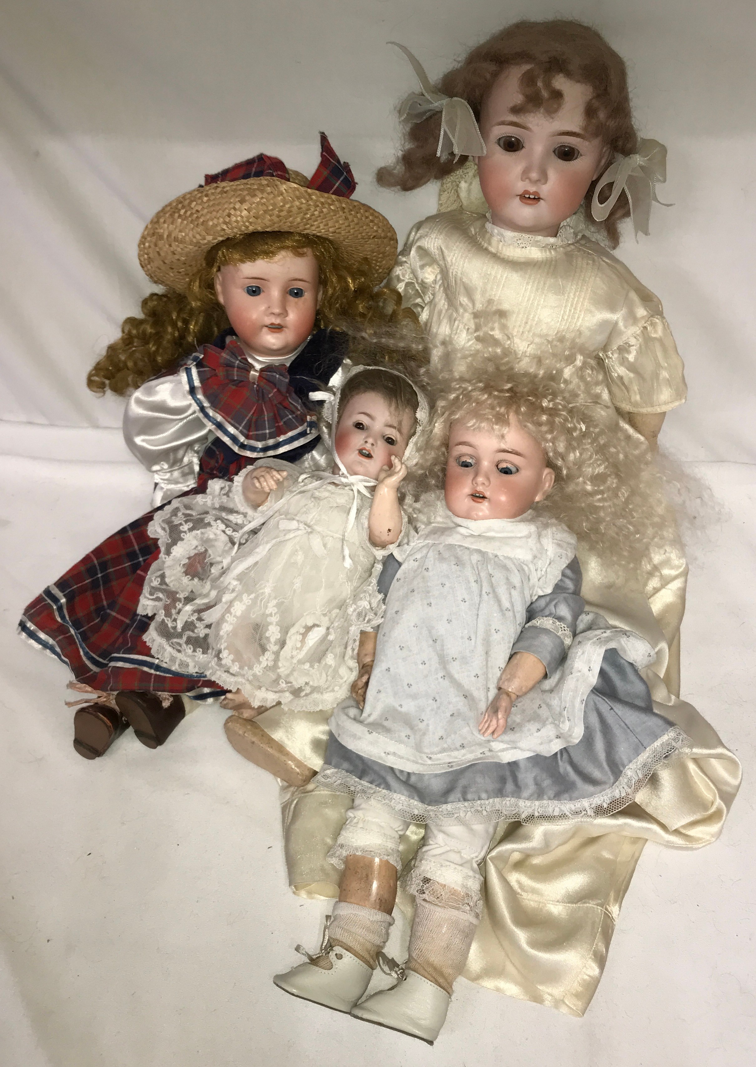 Four bisque headed dolls to include an Alt Beck & Gottschalck with a cropped brown wig, sleeping