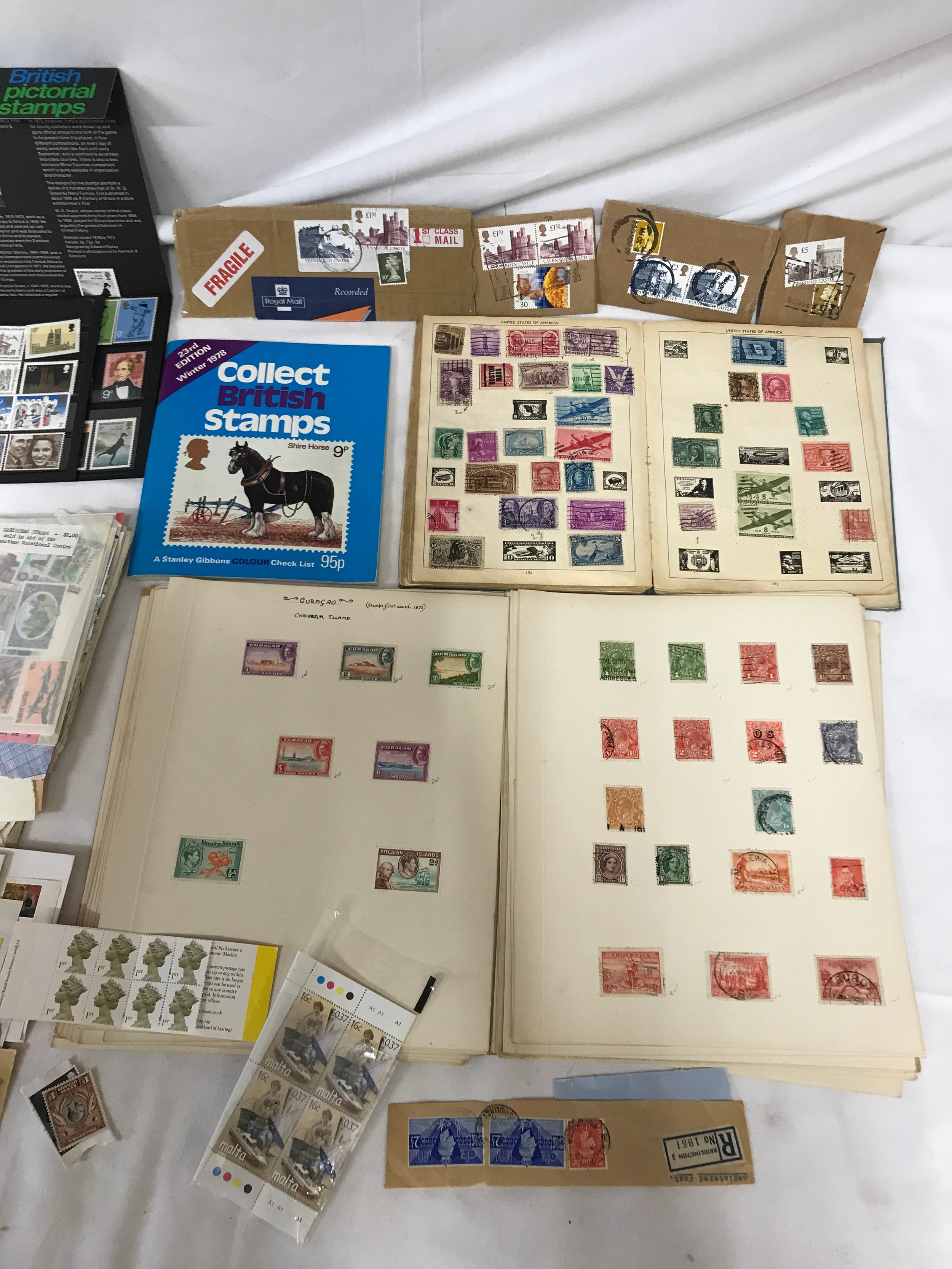 Two albums containing world stamps and an assortment of loose and on covers, old stamp catalogue. - Image 3 of 3